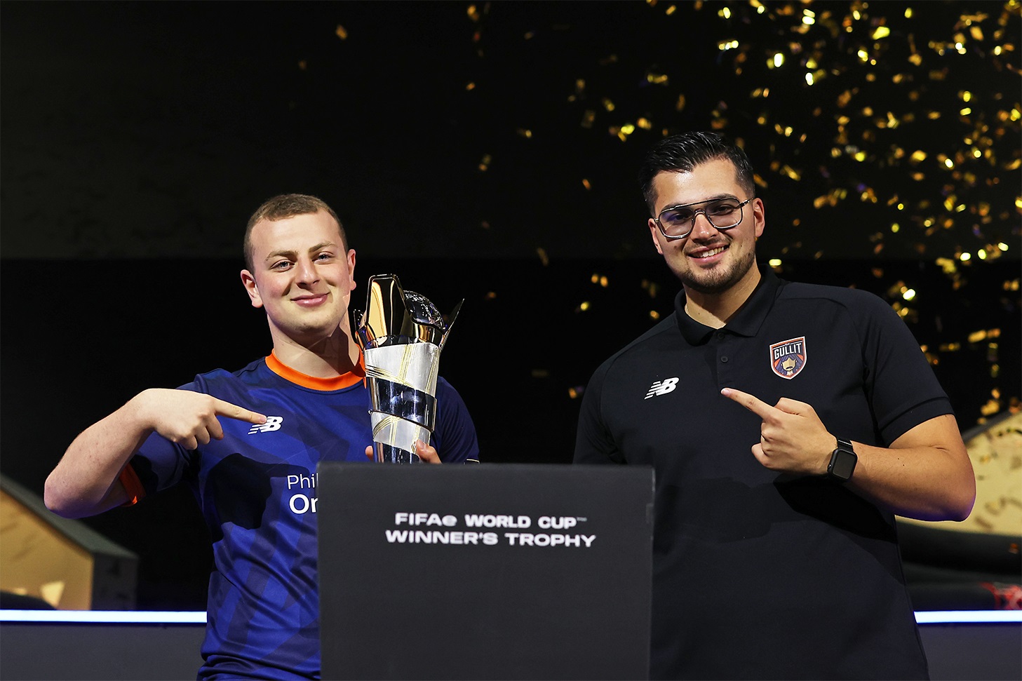 Manuel Bachoore with the FIFAe World Cup trophy, together with Renzo Oemrawsingh.